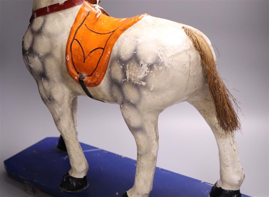 A pre-war papier mache pull-along horse